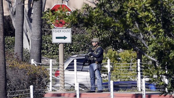 An armed officer is seen outside of the Naval Medical Center San Diego, Tuesday, Jan. 26, 2016, in San Diego - Sputnik International