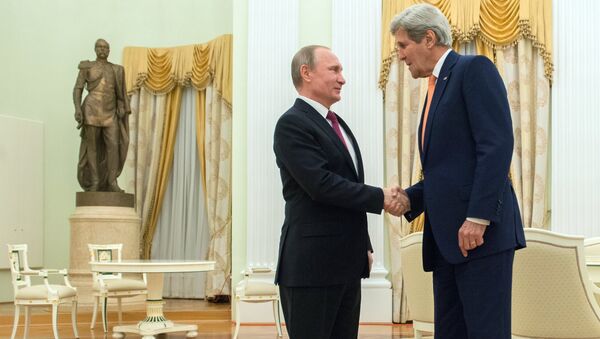 Russian President Vladimir Putin (left) meets with US Secretary of State John Kerry in Moscow. - Sputnik International
