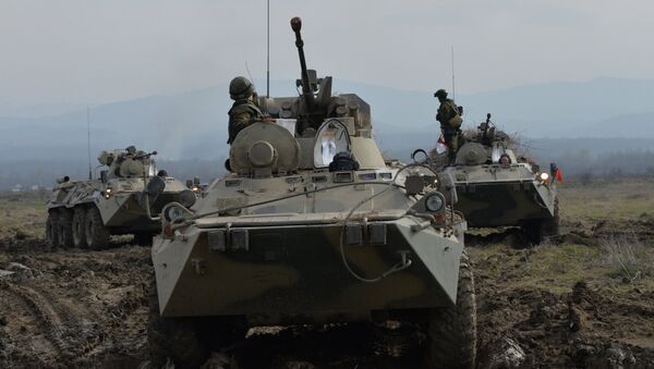 A file photo showing BTR-82A armored vehicles during the battalion tactical field firing exercise - Sputnik International