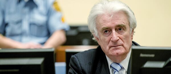 Bosnian Serb wartime leader Radovan Karadzic sits in the courtroom for the reading of his verdict at the International Criminal Tribunal for Former Yugoslavia (ICTY) in The Hague, on March 24, 2016. - Sputnik International