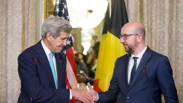 US Secretary of State John Kerry shakes hands with Belgian Prime Minister Charles Michel after delivering a joint statement at the Belgian Prime Minister's Residence in Brussels, Belgium, Friday, March 25, 2016. - Sputnik International