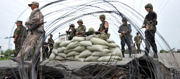 Kyrgyz special unit police officers stand by during patrol at a check point in Osh (file) Kyrgyz special unit police officers stand by during patrol at a check point in Osh (file) - Sputnik International