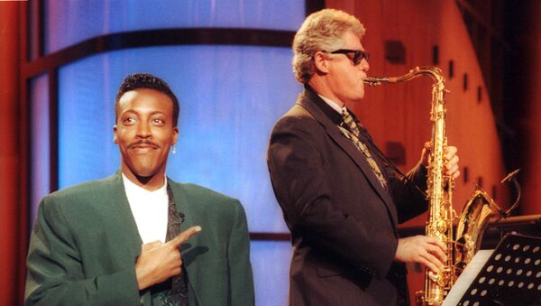 FILE - In this June 3, 1992 file photo, Arkansas Gov. Bill Clinton, plays the saxophone as host Arsenio Hall stands by during a campaign stop on The Arsenio Hall Show in Los Angeles. After two decades, Hall is returning to late night television with The Arsenio Hall Show, premiering on Sept. 9. - Sputnik International