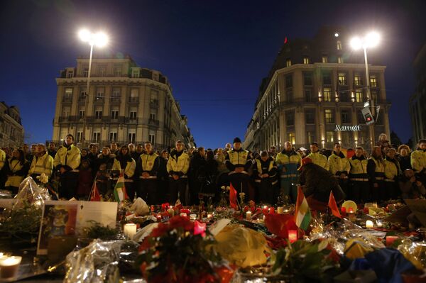 Rescue workers in yellow vests gather at the Place de la Bourse to pay tribute to the victims of Tuesday's bomb attacks in Brussels, Belgium, March 25, 2016. Rescue workers in yellow vests gather at the Place de la Bourse to pay tribute to the victims of Tuesday's bomb attacks in Brussels, Belgium, March 25, 2016. - Sputnik International