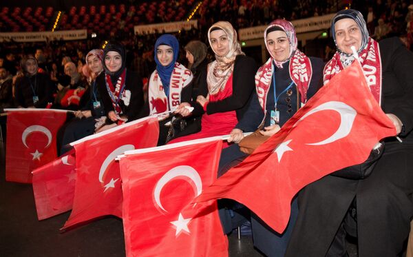 Members of Turkish community holding Turkish flags listen to a speech of Turkish Prime Minister in Tempodrom in Berlin during his state visit. (File) Members of Turkish community holding Turkish flags listen to a speech of Turkish Prime Minister in Tempodrom in Berlin during his state visit. (File) - Sputnik International