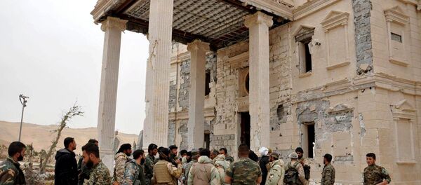 Forces loyal to Syria's President Bashar al-Assad gather at a palace complex on the western edge of Palmyra in this picture provided by SANA on March 24, 2016. - Sputnik International