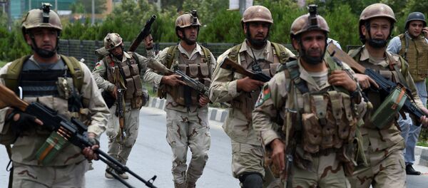 Afghan security personnel arrive at the site of an attack in front of The Parliament Building in Kabul - Sputnik International