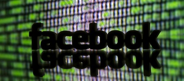 A 3D printed Facebook logo is seen in front of a displayed cyber code in this illustration A 3D printed Facebook logo is seen in front of a displayed cyber code in this illustration - Sputnik International