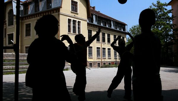 Boys play with a ball in a school yard in central Sofia - Sputnik International