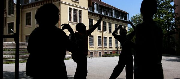 Boys play with a ball in a school yard in central Sofia Boys play with a ball in a school yard in central Sofia - Sputnik International