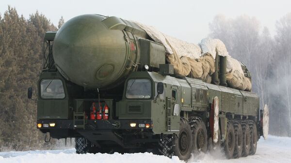 The RT-2PM Topol ballistic missile riding to the site of its permanent deployment with the Strategic Missile Forces of the Central Military District - Sputnik International
