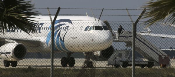 An official boards a hijacked Egyptair A320 Airbus at Larnaca Airport in Larnaca, Cyprus, March 29, 2016 An official boards a hijacked Egyptair A320 Airbus at Larnaca Airport in Larnaca, Cyprus, March 29, 2016 - Sputnik International