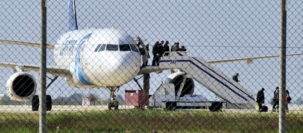 Passengers evacuate a hijacked EgyptAir Airbus 320 plane at Larnaca airport, Cyprus, March 29, 2016 Passengers evacuate a hijacked EgyptAir Airbus 320 plane at Larnaca airport, Cyprus, March 29, 2016 - Sputnik International