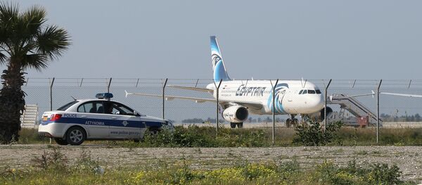 An EgyptAir Airbus A-320 sits on the tarmac of Larnaca airport after it was hijacked and diverted to Cyprus on March 29, 2016 - Sputnik International