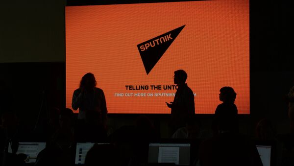 A screen with the logo of the Sputnik international news agency - Sputnik International
