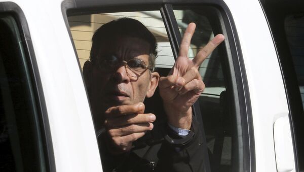 A man named Seif Eldin Mustafa, who was arrested after he hijacked an EgyptAir flight, which was forced to land in Cyprus on Tuesday, gestures as he is transferred by Cypriot police from a court in the city of Larnaca, Cyprus March 30, 2016. - Sputnik International