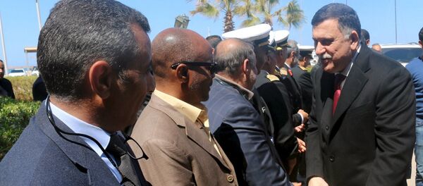 Libyan Prime Minister-designate Fayez Seraj (R) is greeted upon arrival in Tripoli, Libya March 30, 2016 Libyan Prime Minister-designate Fayez Seraj (R) is greeted upon arrival in Tripoli, Libya March 30, 2016 - Sputnik International