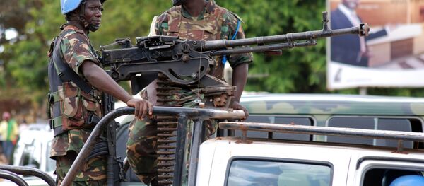 UN soldiers stand post with a machine gun on the back of a pick-up truck on October 23, 2014 in Beni UN soldiers stand post with a machine gun on the back of a pick-up truck on October 23, 2014 in Beni - Sputnik International