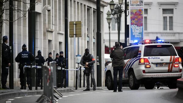 Police block the street outside the council chamber in Brussels, where two terrorism cases will behind closed doors, on March 31, 2016 - Sputnik International