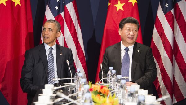 US President Barack Obama (L) sits with Chinese President Xi Jinxing during a bilateral meeting ahead of the opening of the UN conference on climate change COP21 (File) - Sputnik International