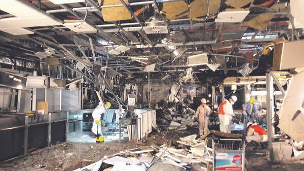Damage is seen inside the departure terminal following the March 22, 2016 bombing at Zaventem Airport, in these undated photos made available to Reuters by the Belgian newspaper Het Nieuwsblad, in Brussels, Belgium, March 29, 2016 - Sputnik International