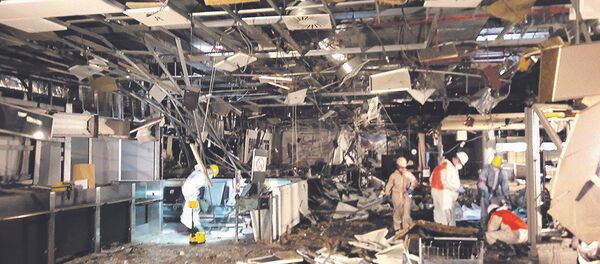 Damage is seen inside the departure terminal following the March 22, 2016 bombing at Zaventem Airport, in these undated photos made available to Reuters by the Belgian newspaper Het Nieuwsblad, in Brussels, Belgium, March 29, 2016 - Sputnik International