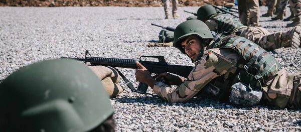 Kurdish Peshmerga soldier aim their weapons during a military training session held by Dutch army trainers at a shooting range, at Bnaslawa Military Base in Irbil, northern Iraq, Wednesday, March 9, 2016 Kurdish Peshmerga soldier aim their weapons during a military training session held by Dutch army trainers at a shooting range, at Bnaslawa Military Base in Irbil, northern Iraq, Wednesday, March 9, 2016 - Sputnik International