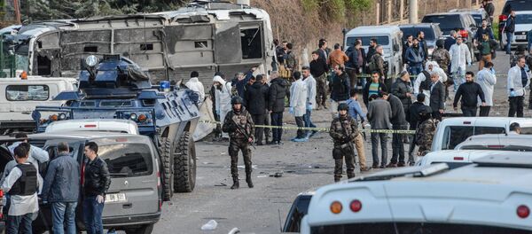 Turkish special force police officers walk at the site of a bomb attack in Diyarbakir, southeastern Turkey, on March 31, 2016 Turkish special force police officers walk at the site of a bomb attack in Diyarbakir, southeastern Turkey, on March 31, 2016 - Sputnik International