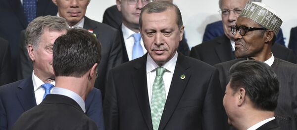 Netherlands Prime Minister Mark Rutte (front, L) and China's President Xi Jinping (front R) look at Turkey's President Recep Tayyip Erdogan (C) while posing in the Nuclear Security Summit family photo at the Walter E. Washington Convention Center on April 1, 2016 in Washington, DC. - Sputnik International