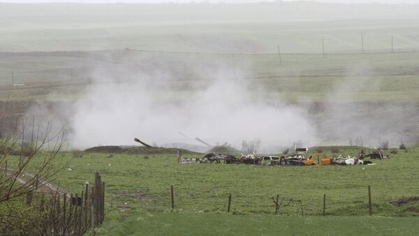 An Armenian artillery unit is seen in the town of Martakert, where clashes with Azeri forces are taking place, in Nagorno-Karabakh region, which is controlled by separatist Armenians, April 3, 2016. - Sputnik International