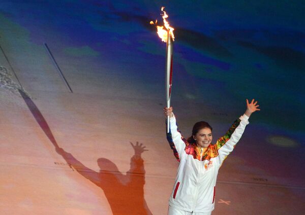 Torch-bearer, State Duma deputy Alina Kabayeva takes part in the final stage of the Olympic Torch Relay at the opening ceremony of the XXII Olympic Winter Games in Sochi. (File) Torch-bearer, State Duma deputy Alina Kabayeva takes part in the final stage of the Olympic Torch Relay at the opening ceremony of the XXII Olympic Winter Games in Sochi. (File) - Sputnik International
