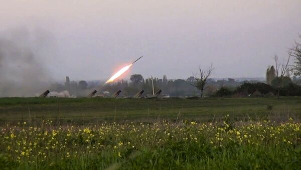 In this image made from video on Sunday, April  3, 2016, a Grad missile is fired by Azerbaijani forces in the village of Gapanli, Azerbaijan. - Sputnik International