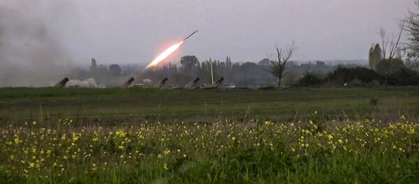 In this image made from video on Sunday, April  3, 2016, a Grad missile is fired by Azerbaijani forces in the village of Gapanli, Azerbaijan. - Sputnik International