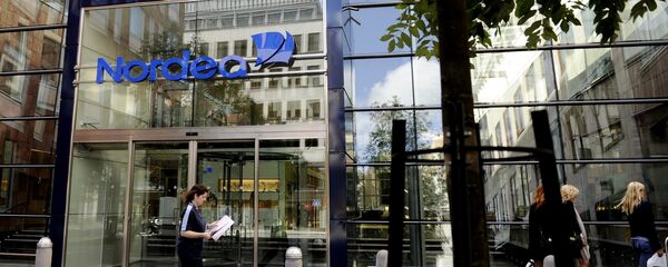 People walk by Nordea Bank headquarters in central Stockholm People walk by Nordea Bank headquarters in central Stockholm - Sputnik International