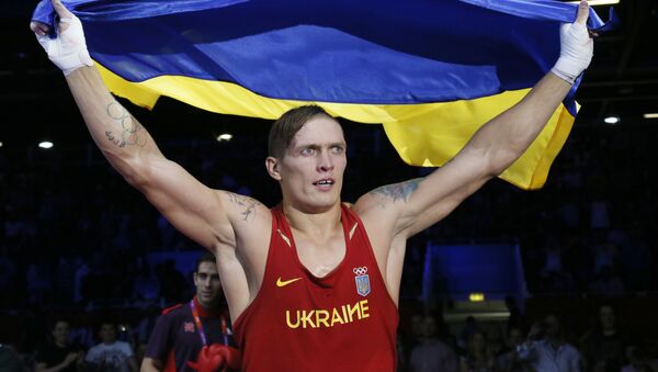 Oleksandr Usyk of the Ukraine waves the Ukrainian national flag - Sputnik International
