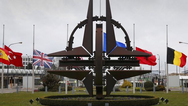 Flags fly at half mast at NATO headquarters in Brussels, March 23, 2016. - Sputnik International