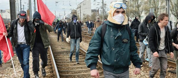 Protesters invade railway tracks during a protest against the French government's planned labour law reforms on April 5, 2016, in Rennes, western France. - Sputnik International