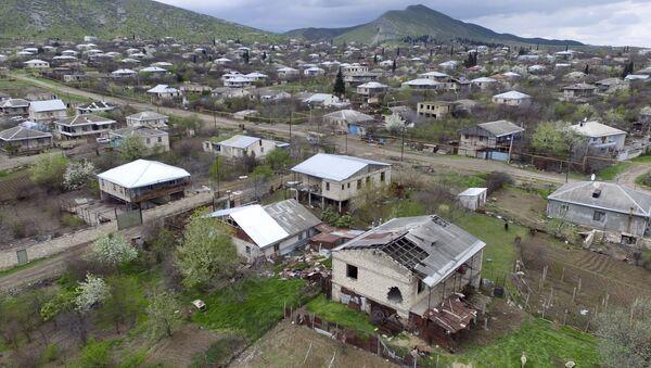 This aerial view shows destroyed houses during the fighting at Martakert province in the region of Nagorno-Karabakh, Azerbaijan, Monday, April 4, 2016 - Sputnik International