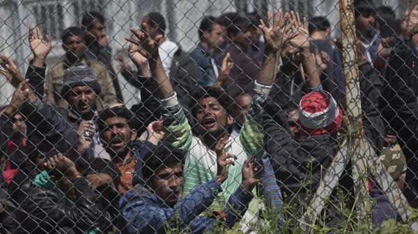 Migrants, most of them from Pakistan, protest against the EU- Turkey deal about migration inside the entrance of Moria camp in the Greek island of Lesbos on Tuesday, April 5, 2016 - Sputnik International