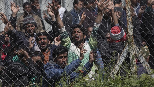 Migrants, most of them from Pakistan, protest against the EU- Turkey deal about migration inside the entrance of Moria camp in the Greek island of Lesbos on Tuesday, April 5, 2016 - Sputnik International
