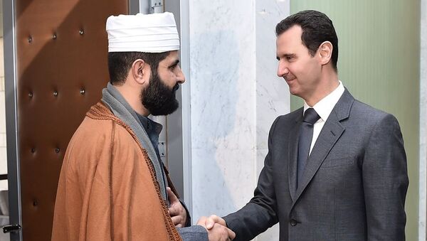 Sheikh Ahmad Bilal meeting with Syrian President Bashar Assad, file photo. - Sputnik International