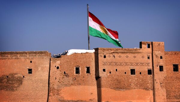 A picture taken on February 3, 2016, shows the Kurdish flag flying over the Arbil Citadel, in the capital of the autonomous Kurdish region of northern Iraq - Sputnik International