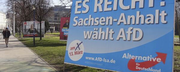 A man walks past a campaign poster of right-populist AfD party reading It's enough - Saxony-Anhalt elects AfD in Magdeburg, Germany. A man walks past a campaign poster of right-populist AfD party reading It's enough - Saxony-Anhalt elects AfD in Magdeburg, Germany. - Sputnik International