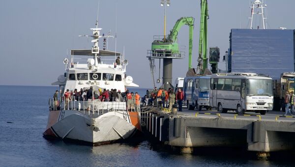 (File) Migrants disembark after they were apprehended by the Turkish coast guard on the Aegean Sea between Turkey and Greece, in Dikili port, Turkey, Wednesday, April 6, 2016 - Sputnik International