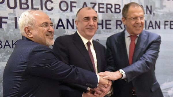 During a meeting of regional powers, from left: Iranian Foreign Minister Mohammad Javad Zarif, Azerbaijan's Foreign Minister Elmar Mammadyarov and Russian Foreign Minister Sergey Lavrov, shake hands in Baku, Azerbaijan, on Thursday, April 7, 2016 - Sputnik International