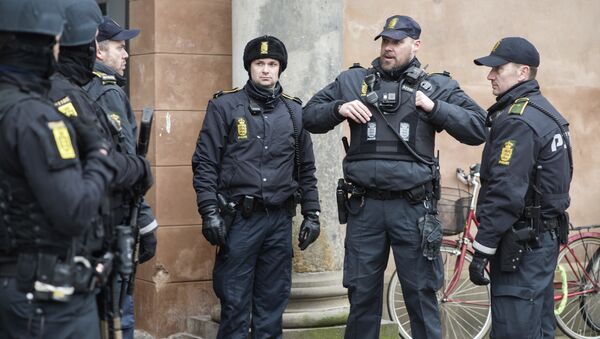 Danish policemen stand guard in front of the city court in Copenhagen, Denmark - Sputnik International