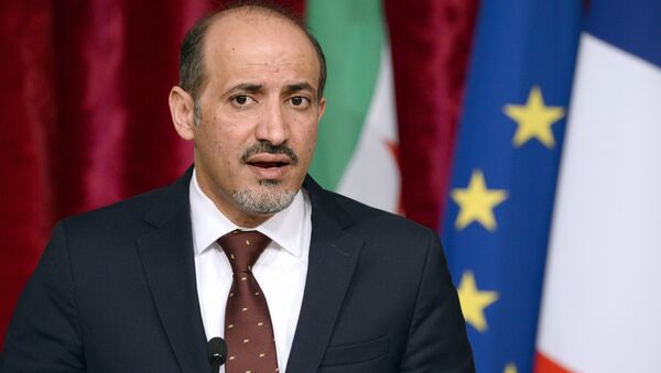 Syrian National Coalition (SNC) leader Ahmad Jarba speaks during a press conference following a meeting with French President at the Elysee palace in Paris on May 20, 2014 - Sputnik International