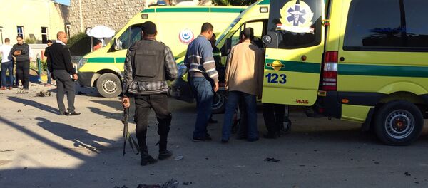 Emergency personnel and security forces stand next to ambulances  in the Egyptian town of El-Arish, in the Sinai peninsula (File) - Sputnik International