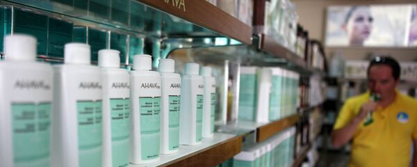A man looks at AHAVA Dead Sea cosmetic products manufactured in the Israeli Kibbutz settlement of Mitzpe Shalem in the Dead Sea resort of Kalya. (File) A man looks at AHAVA Dead Sea cosmetic products manufactured in the Israeli Kibbutz settlement of Mitzpe Shalem in the Dead Sea resort of Kalya. (File) - Sputnik International