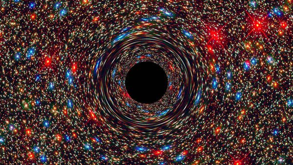The immense black hole at the center of the galaxy NGC 1600 appears to be 17 billion times the mass of the sun. This computer-simulated view shows a supermassive black hole at a galaxy's core. - Sputnik International